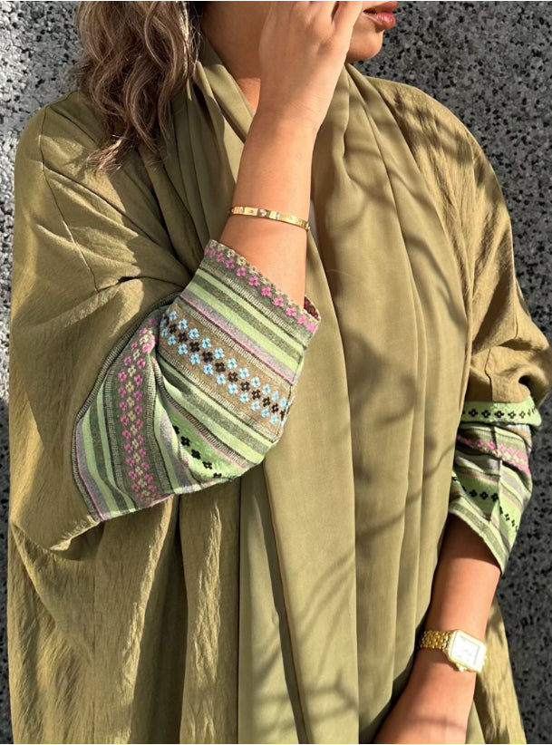 Olive green summer abaya with embroidered sleeves. Comes with a shayla.