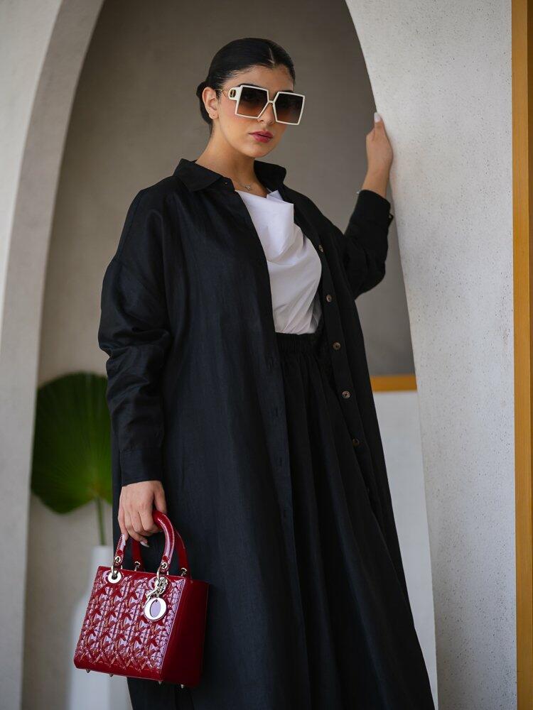 Black Buttoned Coat with a Modern Twist